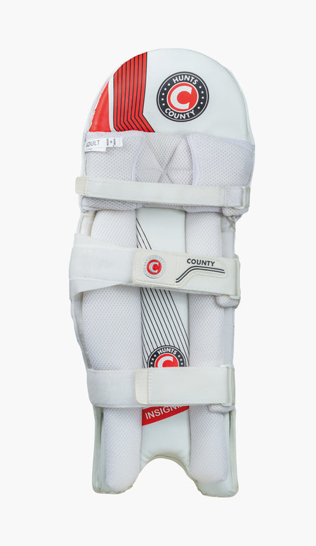 The Hunts County Insignia Batting Pads are white with red and black accents, feature three adjustable straps, and Hunts County branding. These lightweight pads are designed for adult players.