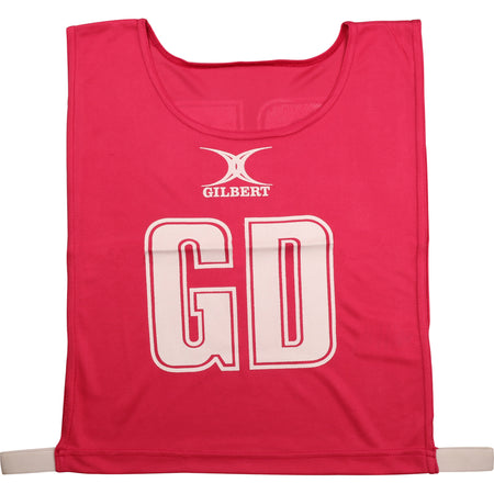 The Gilbert Netball Bibs in pink are made from breathable polyester, featuring bold white GD letters and the Gilbert logo on the front—ideal for your next netball game.