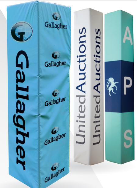 Three tall Custom Printed Senior Rugby Post Protectors by Gilbert: one light blue with Gallagher logos, one white with UnitedAuctions text, and one teal featuring APS branding and a white horse symbol.