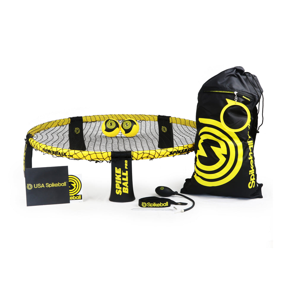 The Kankakee Spikeball Pro Set includes a round net with legs, three yellow balls, a drawstring bag, rule booklet, and accessories—all with the Spikeball logo in black and yellow. Ideal for any tournament set needs.