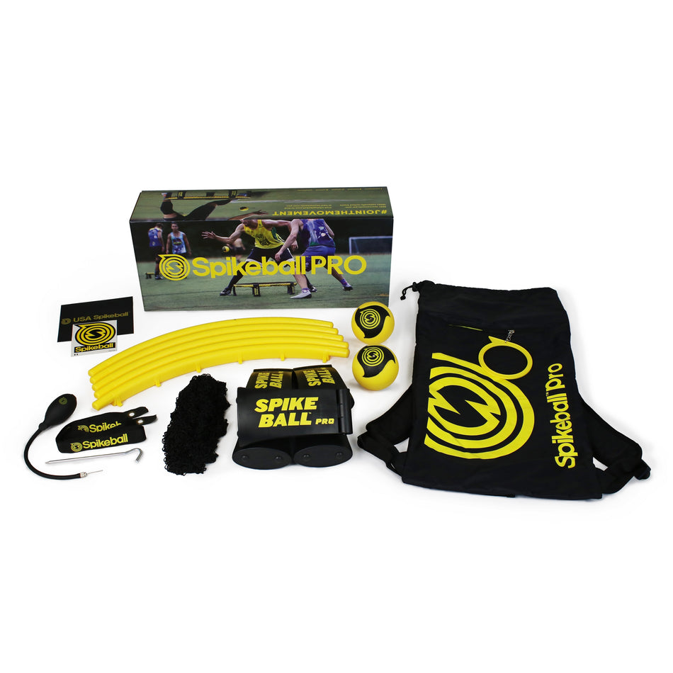 Kankakee Spikeball Pro Set shown with net, yellow rim pieces, two balls, pump, rule book, drawstring bag, and box featuring active players. The official tournament set is neatly arranged on a white background.