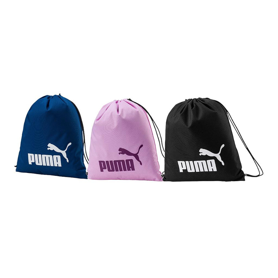 Three Puma Phase Gym Sacks in blue, pink, and black are displayed side by side. Each features the Puma logo—white on blue and black bags, purple on pink. These stylish drawstring sacks offer convenient storage for your gym essentials.
