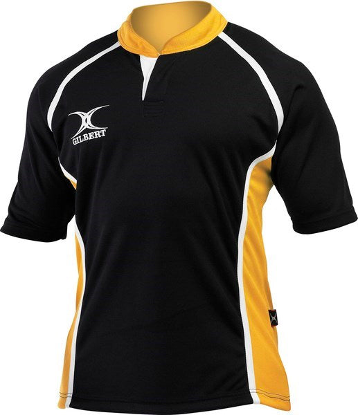The Gilbert Xact 2 Tone Shirt by Gilbert features black and amber colors, short sleeves, a yellow collar, side panels, white piping, and a left chest logo. Displayed on a plain mannequin torso.