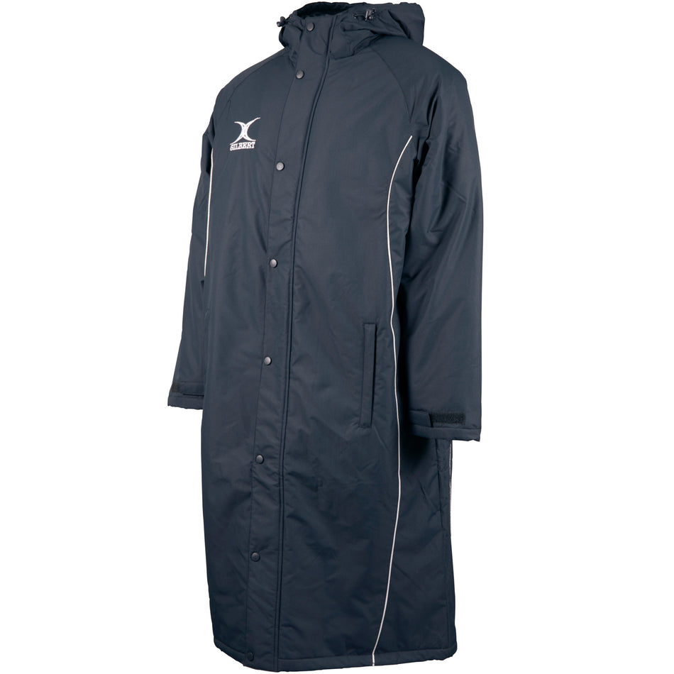 The Gilbert Touchline Sub Jacket by Gilbert is a black long coat featuring a white X and synthetic insulation for extra warmth.