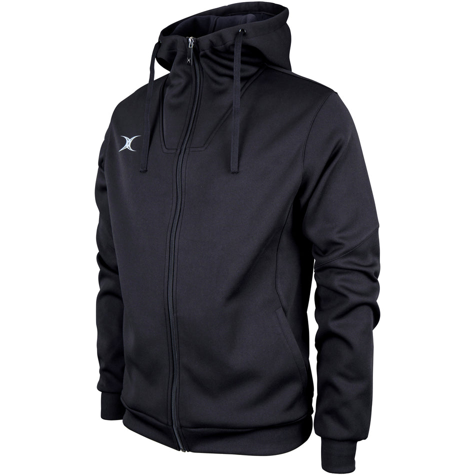 The Gilbert Pro Full Zip Hoody by Gilbert is black with a high collar, drawstring hood, and small white logo on the left chest. Made from active stretch, moisture-wicking fabric, it’s shown on a mannequin against a white background.