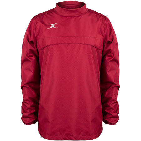 The Gilbert Photon Warm Up Top is a maroon, long-sleeved training top with a high collar, small white Gilbert logo on the upper left chest, smooth fabric, gathered cuffs, and a loose fit.