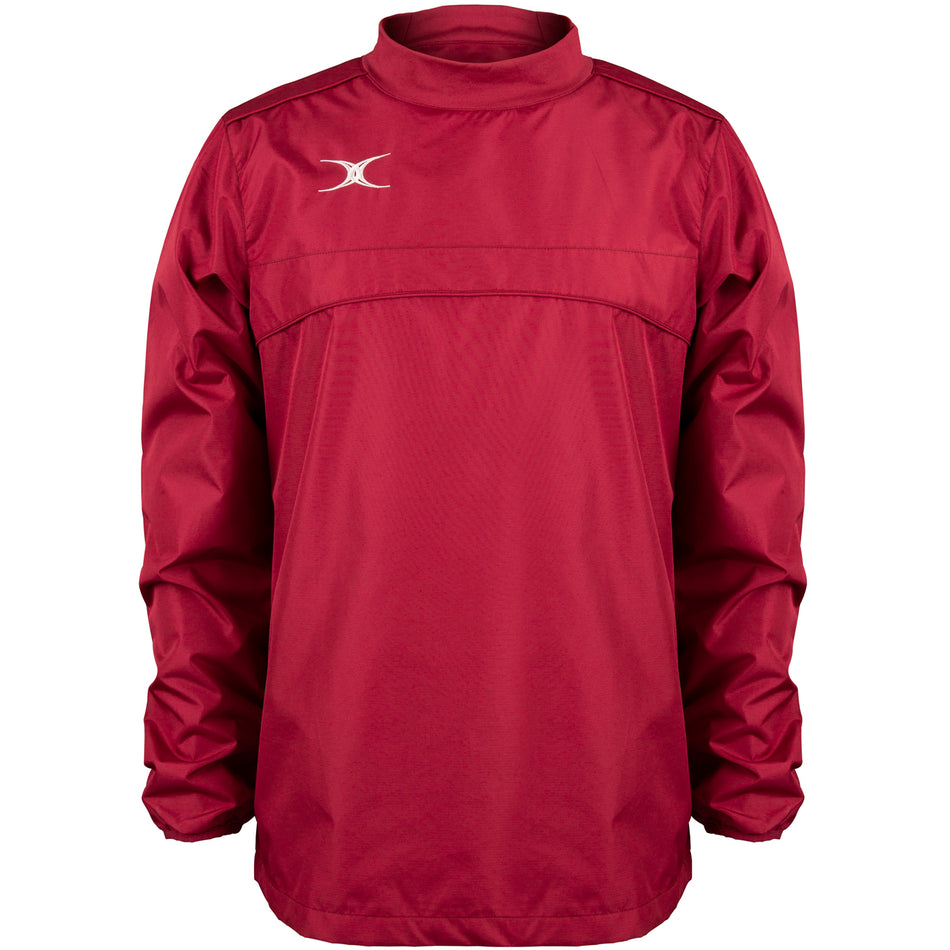 The Gilbert Photon Warm Up Top is a maroon, long-sleeved training top with a high collar, small white Gilbert logo on the upper left chest, smooth fabric, gathered cuffs, and a loose fit.
