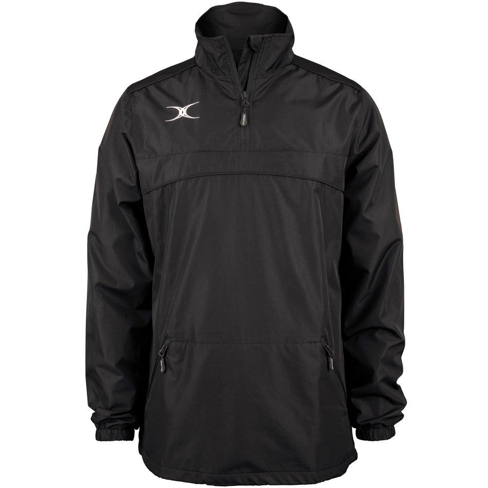 The Gilbert Photon 1/4 Zip Jacket by Gilbert is a black, water-repellent rugby jacket featuring a high collar, two front zippered pockets, elastic cuffs, and a small white logo on the left chest. Displayed on a plain white background.
