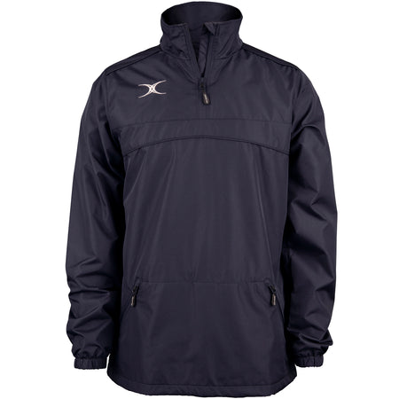 The Gilbert Photon 1/4 Zip Jacket by Gilbert is a dark navy, long-sleeve water-repellent jacket with a front quarter zipper, two zippered side pockets, elastic cuffs, and a small white logo on the upper left chest—ideal for warm-ups.