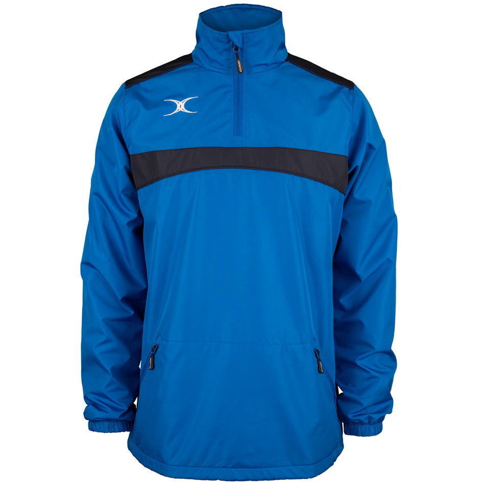 The Gilbert Photon 1/4 Zip Jacket by Gilbert comes in royal/navy with a black stripe across the chest, zippered pockets, elastic cuffs, a high collar, and features a white logo on the upper left side.