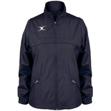 The Gilbert Photon Women's Full Zip Jacket by Gilbert is a navy blue rugby jacket featuring a high collar, two front zippered pockets, and a white abstract logo on the left chest. Shown on a plain white background.
