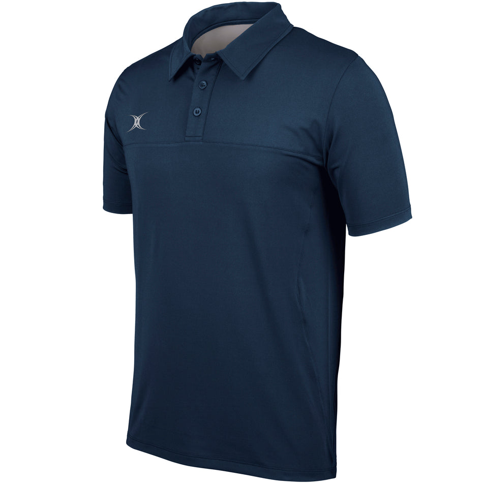The Gilbert Pro Tech Polo by Gilbert is a navy short-sleeve shirt with a button-up collar and small white logo on the left chest. Designed for moisture management, this athletic essential is shown on a plain white background.