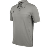 The Gilbert Pro Tech Polo is a grey short-sleeve shirt with a collar, three black buttons, and a small black left-chest logo. Made by Gilbert for off-field wear, it’s shown on a white background.