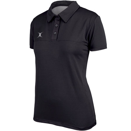 The Gilbert Womens Pro Tech Polo is a black, short-sleeve women's polo with a collar, three buttons, and a small white logo on the left chest. This rugby top offers smooth, moisture-wicking fabric for a comfortable, tailored fit.