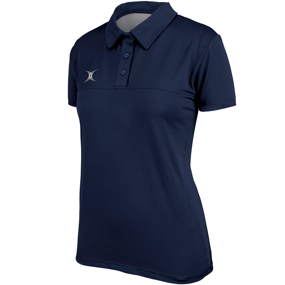 The Gilbert Womens Pro Tech Polo is a blue polo with a white x, designed for moisture management—ideal for women’s rugby collections.