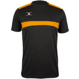 The Gilbert Photon Tee by Gilbert is a black/gold short-sleeve gym shirt featuring a bold gold stripe across the chest and shoulders, plus a small white logo on the left chest. Moisture control technology ensures comfort during intense workouts.