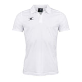 The Gilbert Photon II Polo Shirt by Gilbert is a white short-sleeve polo featuring moisture control, a collar with three buttons, and a small black logo on the left chest. Ideal for workout training or casual wear, it's shown against a white background.