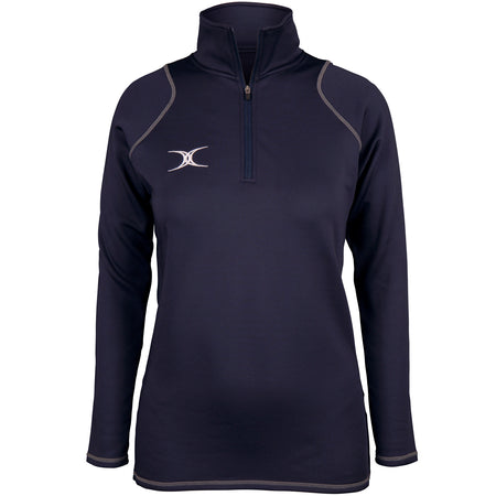 The Gilbert Womens Quest II Fleece is a navy long-sleeve pullover with a quarter-zip front, gray stitching, white embroidered left-chest logo, and high collar by Gilbert. Shown on a plain white background.