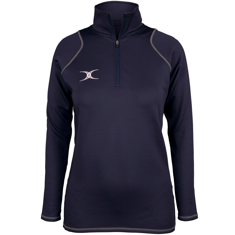 The Gilbert Womens Quest II Fleece is a navy long-sleeve pullover with a quarter-zip front, gray stitching, white embroidered left-chest logo, and high collar by Gilbert. Shown on a plain white background.