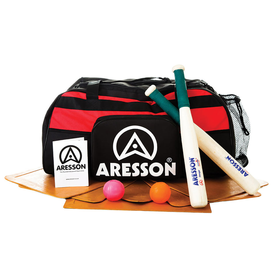 The Aresson Junior Indoor Rounders Set includes a black and red Aresson bag, two bats, three balls (2 pink, 1 orange), two wooden bases, a base mat, and an instruction booklet—everything needed for indoor rounders.