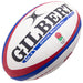 Celebrate England Rugby with the Gilbert England Replica Rugby Ball. This Size 5 ball features blue and red stripes, bold GILBERT branding, the iconic rose logo, and "Official Replica Ball"—ideal for Rugby World Cup 2023 fans.