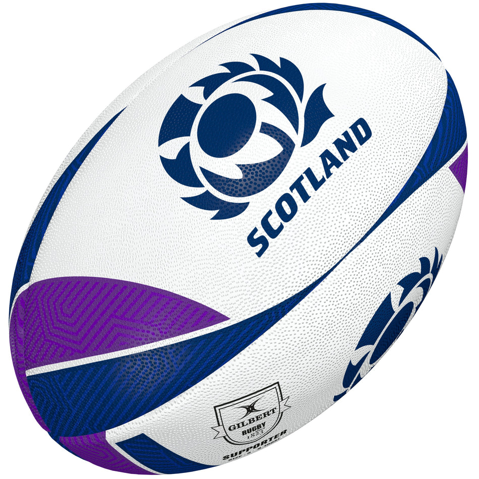 The Gilbert Scotland Supporters Rugby Ball by Gilbert features blue and purple accents, the Scotland rugby team logo, and "SCOTLAND"—an authentic choice for fans.