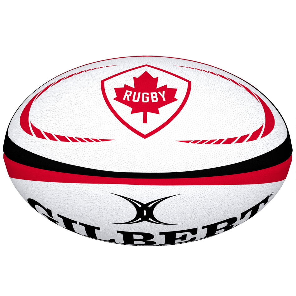The Gilbert Canada Replica Rugby Ball by Gilbert features red and black accents, a red maple leaf and "Rugby" in the center—making it an ideal piece for any World Cup memorabilia collection.