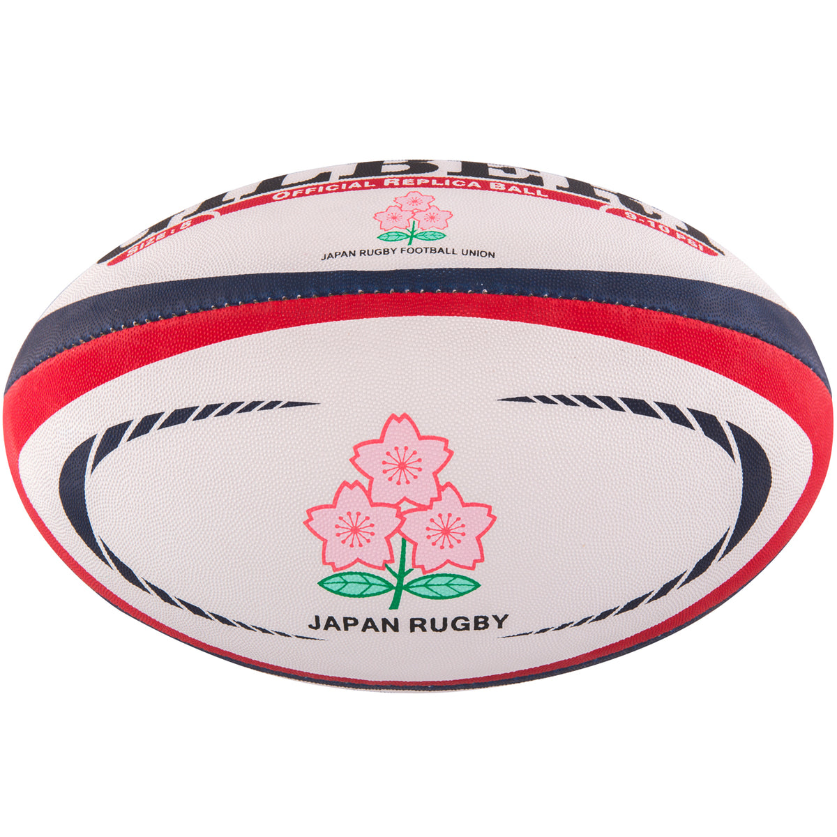 The Gilbert Japan Replica Rugby Ball by Gilbert is white with red and blue stripes, features two pink Cherry Blossoms with green stems, and has "JAPAN RUGBY" printed below the flowers.