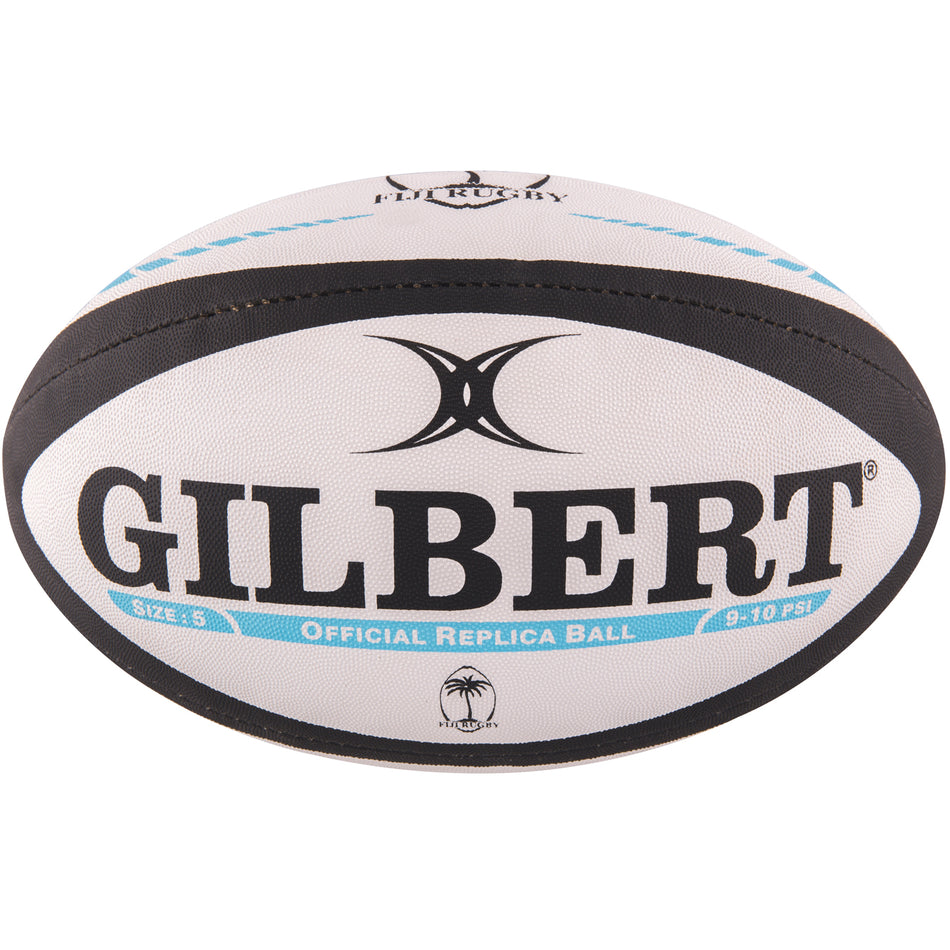 The Gilbert Fiji Replica Rugby Ball features a white design with black accents, bold GILBERT branding, the logo above, and "OFFICIAL REPLICA BALL" in blue—ideal for any Fiji rugby or Rugby World Cup 2023 fan.