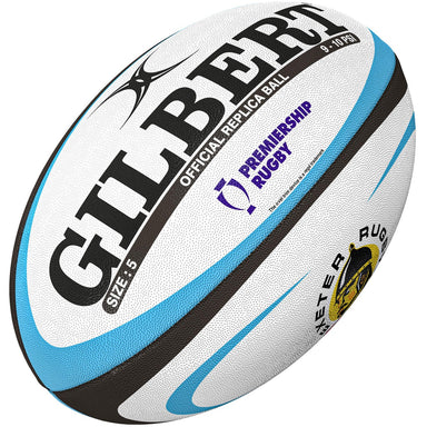 The Gilbert Exeter Chiefs Replica Rugby Ball, size 5, features white with blue and black accents, the Gilbert brand, Gallagher Premiership Rugby logo, and Exeter Rugby crest. It's an official supporter product for fans.