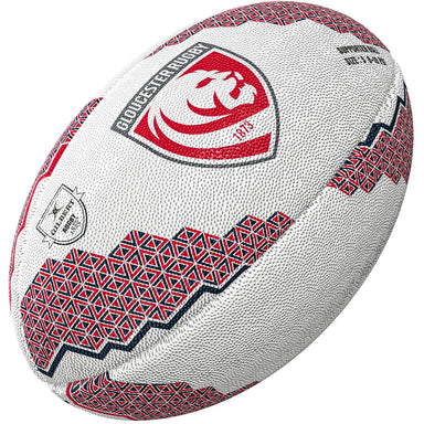 The Gilbert Gloucester Supporter Rugby Ball by Gilbert features red and black geometric patterns with the club’s lion logo and “1873” in the center—ideal for any Gallagher Premiership fan or rugby supporter ball collection.