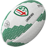 The Gilbert London Irish Supporter Rugby Ball by Gilbert is white with green geometric patterns, features the London Irish logo—a red cross with green shamrocks—plus "London Irish" text. Ideal for any London Irish fan from Gallagher Premiership Rugby.