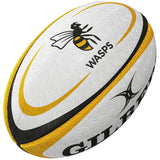 The Gilbert Wasps Replica Rugby Ball by Gilbert features yellow and black accents, a wasp logo, and WASPS text—perfect for Gallagher Premiership Rugby fans or your rugby supporters collection.