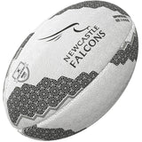 The Gilbert Newcastle Falcons Supporter Rugby Ball by Gilbert features the Newcastle Falcons logo, black geometric patterns, Gallagher Premiership Rugby branding, and a stylized falcon—ideal for any supporter.