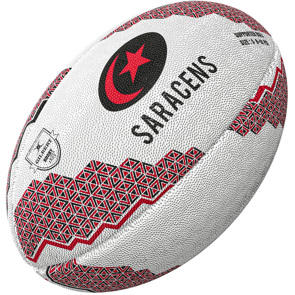 The Gilbert Saracens Supporter Rugby Ball by Gilbert features red and black geometric patterns, the word SARACENS, a red star in a crescent, and logo—ideal rugby memorabilia for any Premiership Rugby fan.