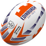 The Gilbert Edinburgh Supporters Rugby Ball features orange and navy geometric patterns, "Edinburgh Rugby Est. 1872," the Gilbert logo, and a size 5-10 PSI—making it a perfect unique rugby gift.