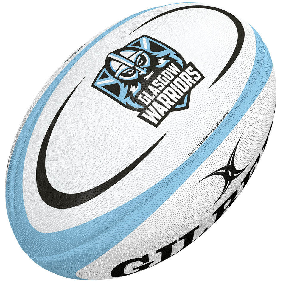 The Gilbert Glasgow Replica Rugby Ball is a white ball with blue accents, featuring the Glasgow Warriors logo and name on one side and the Gilbert logo on another—a great choice for any rugby supporter.