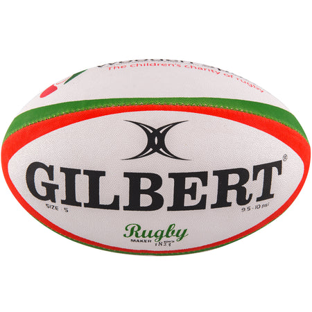 The Gilbert Wooden Spoon Rugby Ball is white with green and red stripes, featuring the bold black Gilbert logo and "Rugby" in green script—a great choice for charity support.