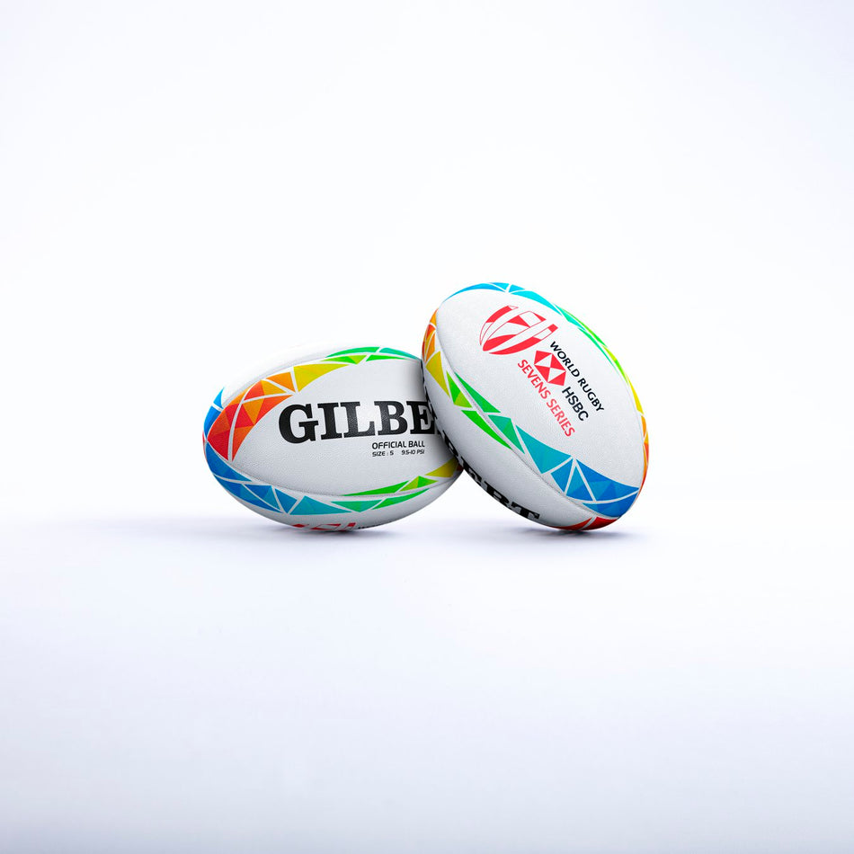 Two Gilbert HSBC World 7s Series Replica Rugby Balls with colorful geometric patterns, featuring the Gilbert brand and the HSBC World Sevens Series logo on a white background.