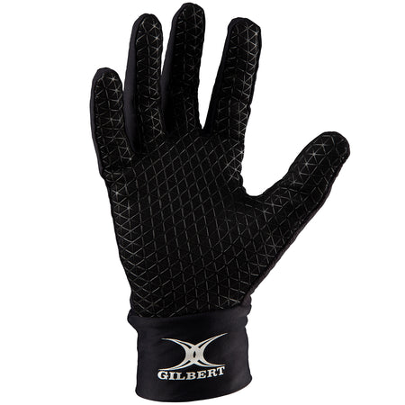 The Gilbert Thermo Training Gloves are black fleece-lined gloves with a grippy silicone palm, textured fingers, and the white Gilbert logo on the wrist area. The glove is shown palm facing forward.