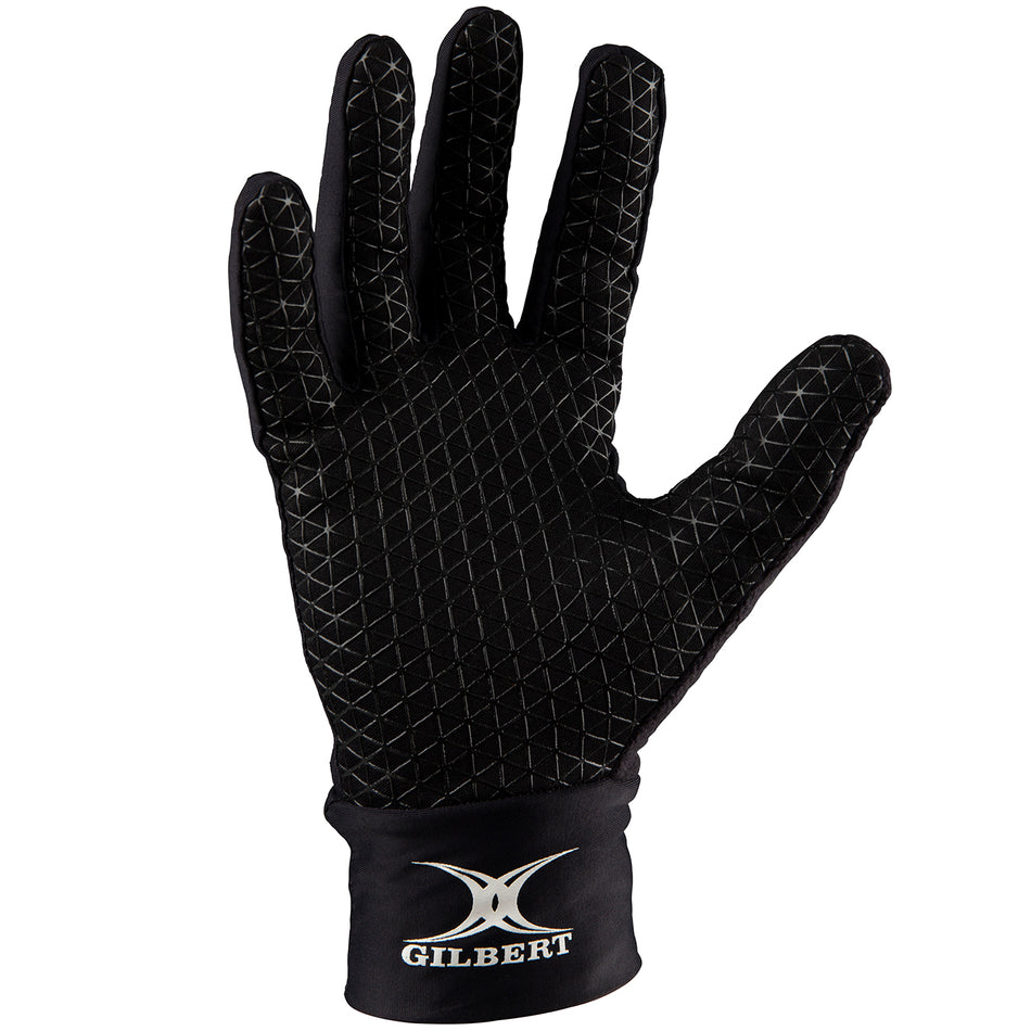 The Gilbert Thermo Training Gloves are black fleece-lined gloves with a grippy silicone palm, textured fingers, and the white Gilbert logo on the wrist area. The glove is shown palm facing forward.