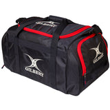 The Gilbert Performance Holdall is a black kit bag with red trim, zippered compartments, two handles, and a shoulder strap. The white Gilbert logo and name appear on the side and end of this branded rugby holdall.
