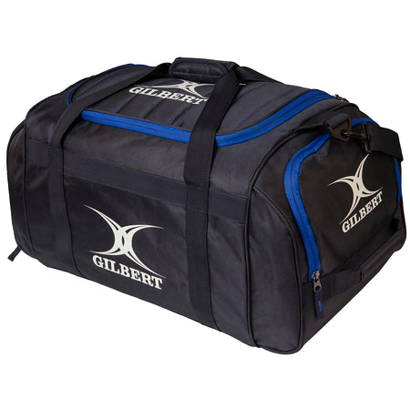 The Gilbert Performance Holdall is a large black kit bag with blue accents and sturdy handles, displaying the white Gilbert brand name and logo on the side and top.