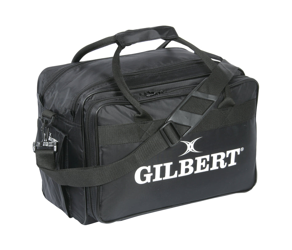 The Gilbert Physio Bag is a black sports bag with handles and a shoulder strap, featuring the white Gilbert logo—perfect for teams to use as a physio bag or sports injury kit on the go.