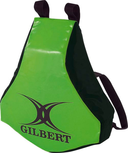 The Gilbert Body Wedge is a green and black rugby tackle shield with shoulder straps, perfect for tackling practice. This must-have training tool features the Gilbert logo on the front.