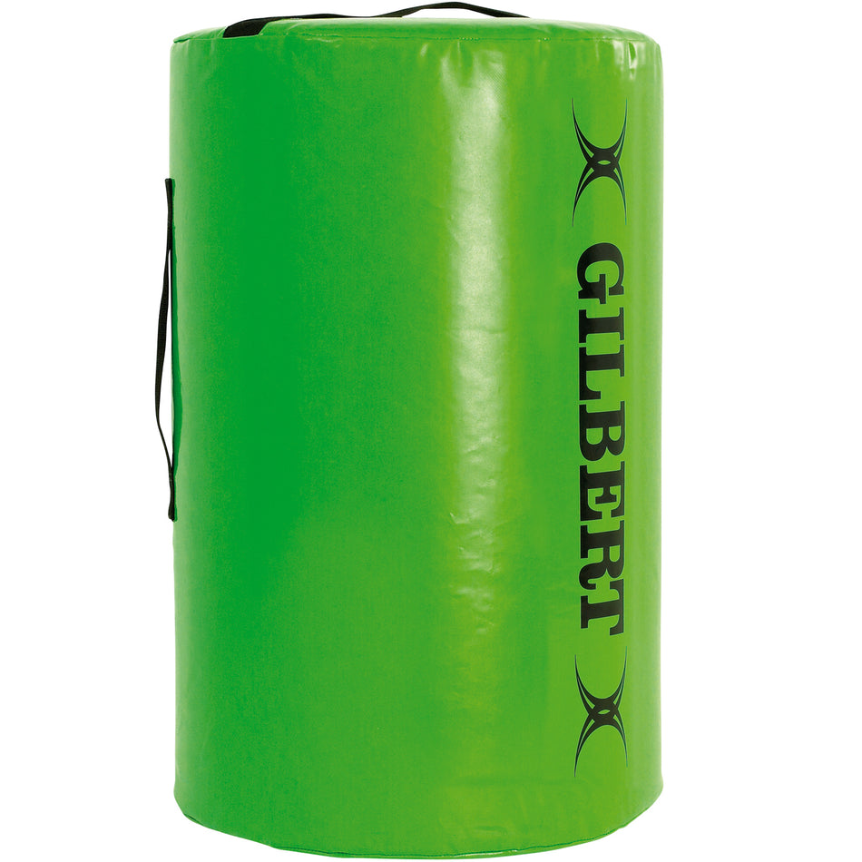 The Gilbert Point 5 Tackle Bag Senior is a large, green cylindrical training aid with black handles and "GILBERT" printed vertically in black, designed to improve tackling technique during rugby practice.