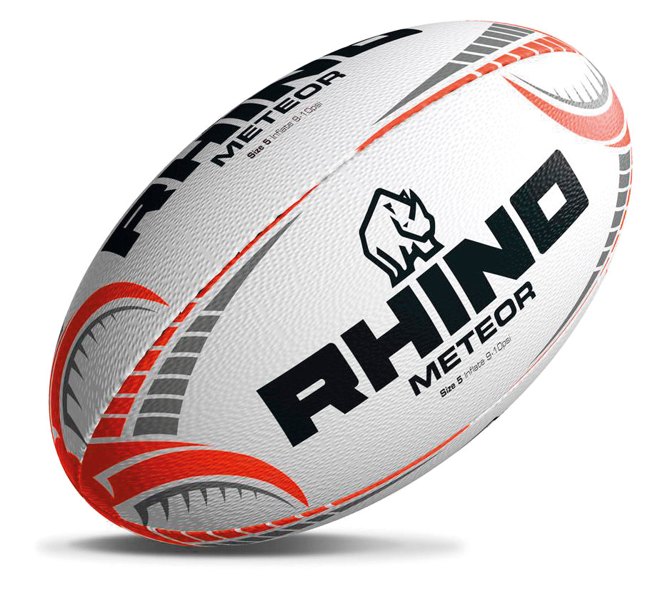 The Rhino Meteor Match Rugby Ball features black and orange patterns, red and silver designs, a textured hand-stitched white surface, and displays the Rhino logo and text in black.