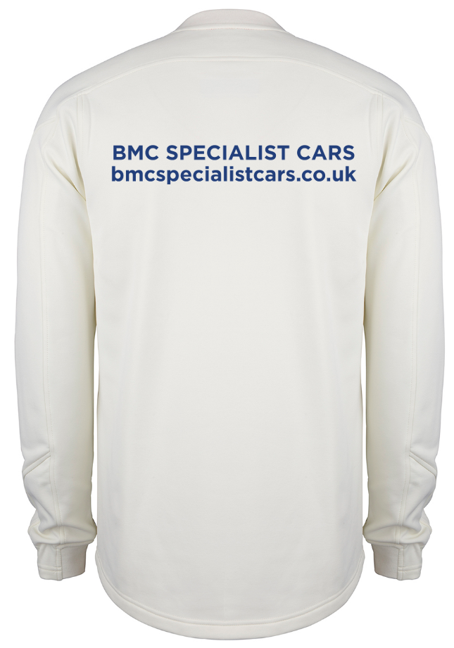 The back of the Gray Nicolls Rockhampton CC Pro Performance Sweater - Senior in white shows blue text reading BMC SPECIALIST CARS and bmcspecialistcars.co.uk across the upper back.
