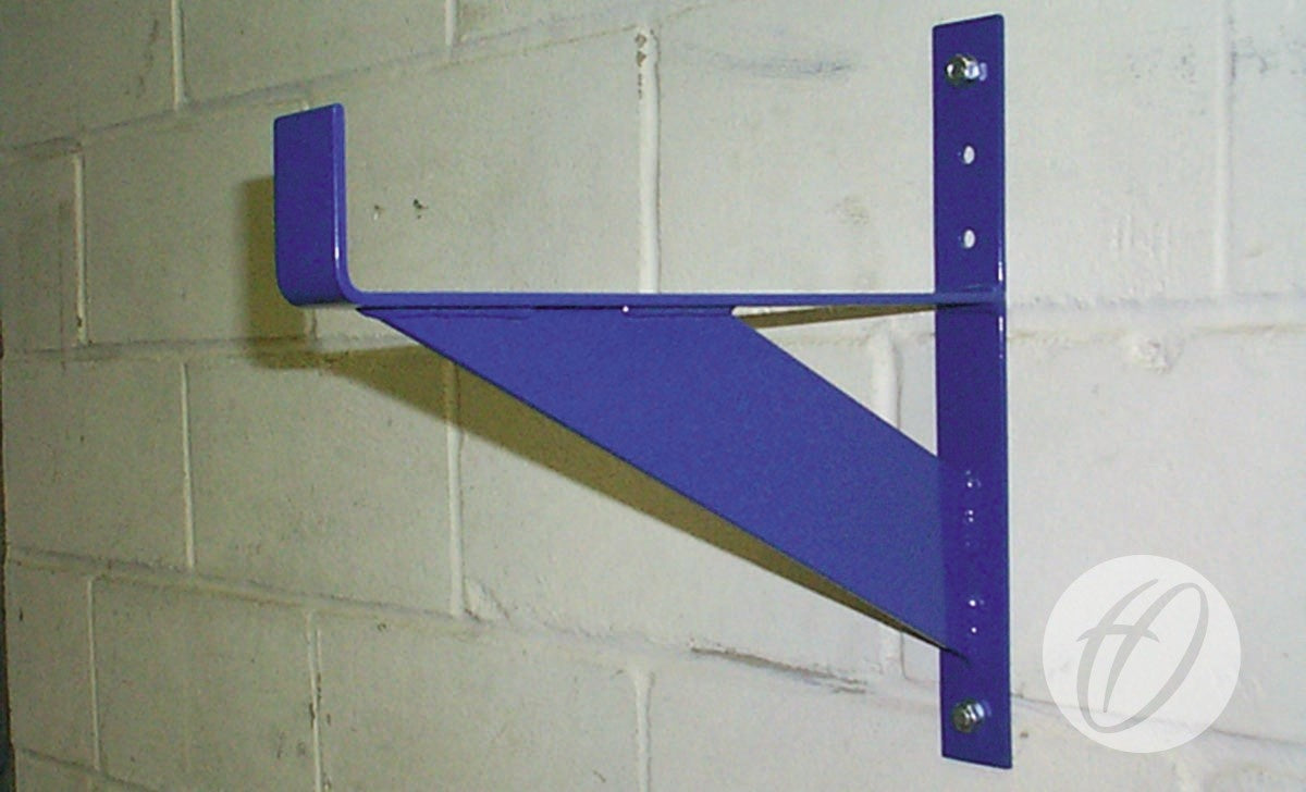 Harrod Sport Heavy Duty Storage Brackets in purple, with hook, diagonal support, and circular logo, are mounted to a light cinder block wall. Designed for goals/posts storage with a 400kg max load capacity.