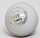 A close-up of the MBS Supreme Crown Cricket Ball (White), this hand-stitched leather ball by Martin Berrill Sports features visible stitching, branding, "Hand made" text and details about meeting MCC regulations.